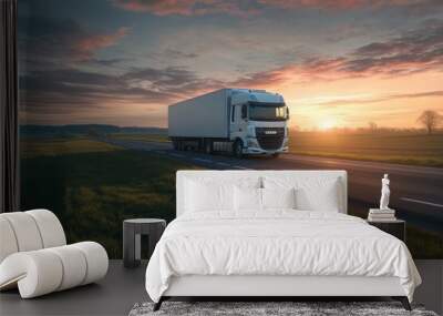 White truck on asphalt road in rural landscape at sunset Wall mural