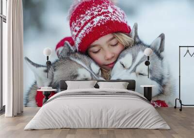 Young girl cuddling huskies outside in Lapland Wall mural