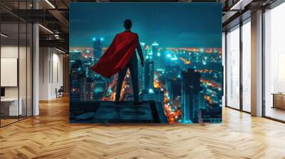 Young superhero businessman on rooftop with city view at night symbolizing leadership and success Wall mural