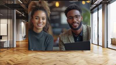 A professional job interview setting with two people, one holding a black folder and looking at camera Wall mural