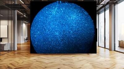 Christmas ornaments with blue light reflections makes it look like a shining star in the space Wall mural