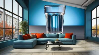 Glass of water on the table Wall mural