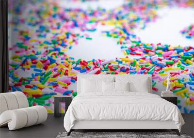 Colorful candy sprinkles close up for birthday cake on white background Wall mural