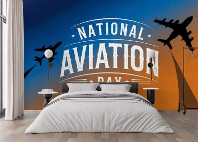 Silhouette of two airplanes against a sunset sky with the words National Aviation Day Wall mural