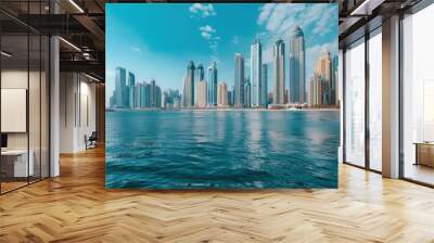 Stunning view of Dubai Marina skyline with modern skyscrapers reflecting in the blue water. Concept of travel, tourism, luxury, and urban development. Wall mural