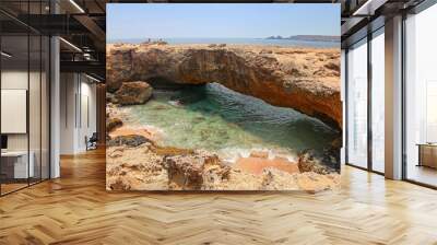 Natural Bridge, that was formed out of coral limestone, Aruba, Lesser Antilies, Caribbean. Wall mural