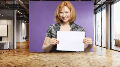 Beautiful woman with a blank (paper) for your text Wall mural