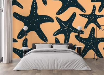 Colorful illustration of underwater world. Vector seamless pattern with hand drawn dark blue starfish on yellow background. Beautiful tile with sea coast life organic vibrant shapes. Ocean aesthetics. Wall mural