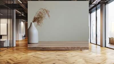 Dry reed in modern vase on the wooden table indoor Wall mural