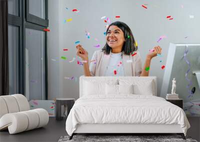 young business woman having fun time catching confetti Wall mural