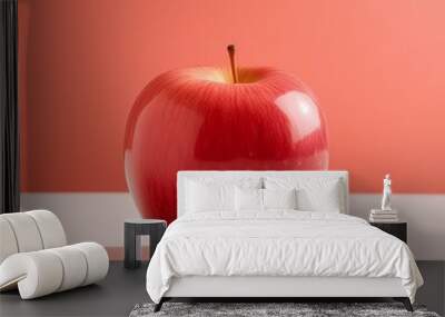 Vibrant Red Apple on Coral Background Wall mural