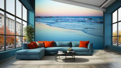 Beautiful ocean shoreline at beach at sunset Wall mural