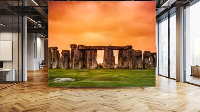 Stonehenge against fiery orange sunset sky Wall mural