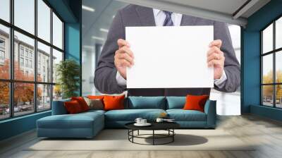 Businessman hand holding We are hiring white board. Wall mural