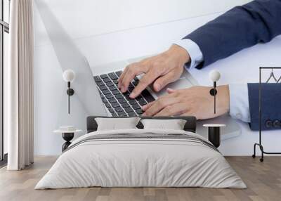 Businessman hands typing on laptop computer Wall mural