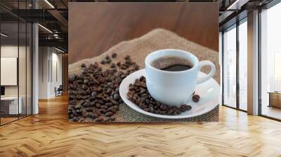 Hot coffee cup with roasted coffee beans Wall mural