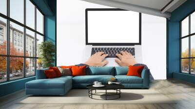 Man hand typing on laptop keyboard with blank screen monitor Wall mural