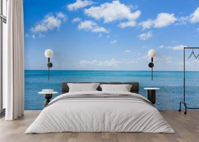 seascape with clouds and blue sky background Wall mural