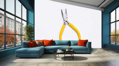 Yellow plier on white background Wall mural