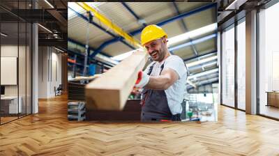 Factory worker checking wood material for further production. Wood industry. Wall mural