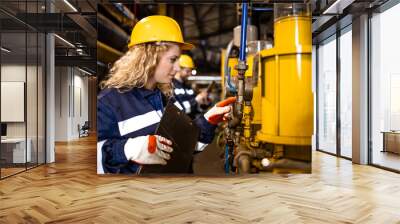 Factory workers working together in heating plant controlling gas pipeline installations. Wall mural