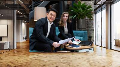 Business business meeting, two businessmen Asian man and woman, business discussion, international business partners hold a meeting Wall mural