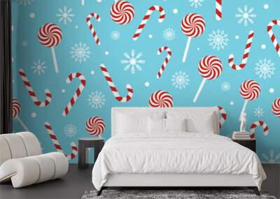 Christmas seamless pattern with candy canes, lollipops, snowflakes, snow ball on blue background. Design for wrapping paper, print, greeting cards. Winter Holiday concept. Vector illustration Wall mural