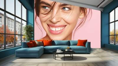 Close-up of fresh natural woman with nude makeup, white smile, looking aside on pink background. Romantic girl with clean hydrated skin, well-nourished smooth face Wall mural