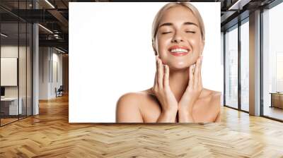 Portrait of happy smiling blond woman touches her face with pleasure, enjoys skincare cosmetic after effect, washes her skin with cleansing gel, hyaluronic acid for smooth face without blemishes Wall mural