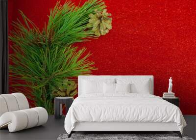 Red Christmas background with Christmas tree branch and Christmas balls and toys Wall mural