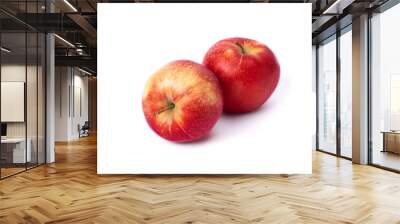 Two red apples on a white background. Juicy apples of red color with yellow specks. Fruit is ripe and juicy on a white background. Wall mural