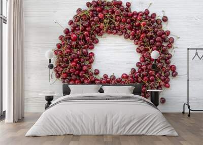 Circle made of ripe cherry, top view. Copy space. Wall mural