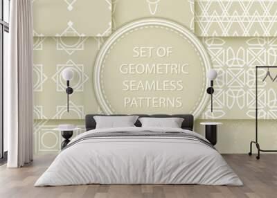 Compilation of seamless patterns. White abstract and geometric prints on olive green background Wall mural