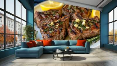 Grilled lamb chops with garlic, rosemary, and lemon wedges on a white plate Wall mural