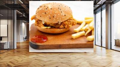 Homemade Chicken Strips Burger with French Fries and sour-sweet sauce on rustic board, side view. Close-up. Wall mural