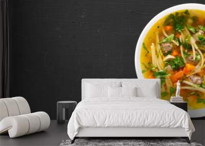 Homemade Sopa a La Minuta in a white bowl on a black background, top view. Flat lay, overhead, from above. Copy space. Wall mural