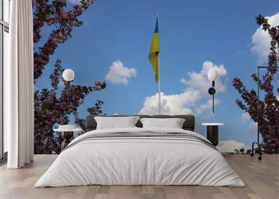 Ukrainian flag on blue sky. Country flag against sky. Flags of the world. Peace in the world. Peaceful flag.
 Wall mural