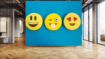 Smileys in the form of gingerbread on the blue background.Top view.Closeup.Copy space. Wall mural