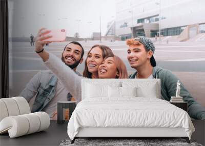 group of multicultural happy friends takes a selfie. Wall mural