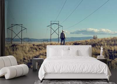 Man walking under Powerlines Wall mural