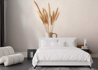 In an elegant interior still life, a modern, organic vase with geometric shapes holds dry flowers and grass. A pile of old books and a cup of coffee adorn a wooden table Wall mural