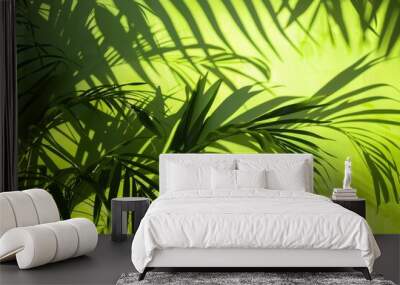 Palm trees silhouetted against lush green scenery Wall mural