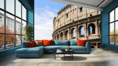 Close up of the Colosseum in Rome in Italy on a Sunny day against a blue sky Wall mural