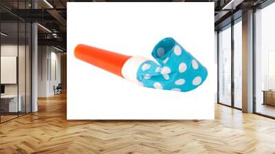 Rolled festive noisemaker or party whistle horn on the white isolated Wall mural