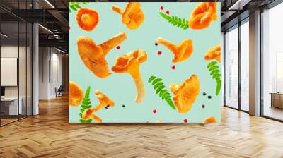 Raw fresh chanterelle mushrooms with fern on blue background. Wall mural