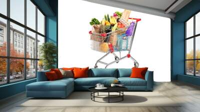 A shopping cart full with various groceries Wall mural