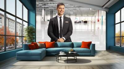 Airport official in a suit and tie posing Wall mural