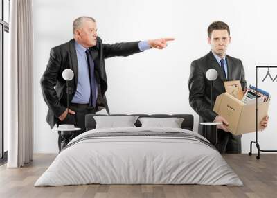 Angry boss firing a man carrying a box of personal items Wall mural