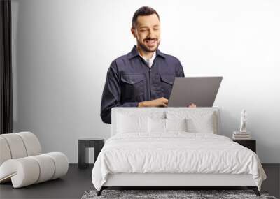 Auto mechanic working on a laptop computer Wall mural