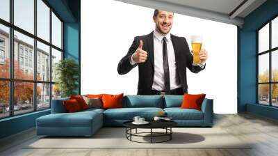 Cheerful businessman holding a glass of beer and showing thumbs up Wall mural